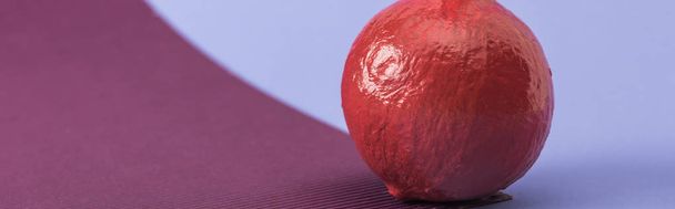 panoramic shot of red colorful painted pumpkin on violet and purple background - Photo, Image