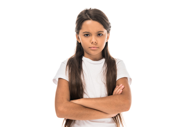 sad kid standing with crossed arms isolated on white - Фото, изображение