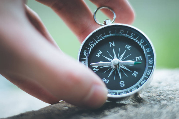 Vintage compass in mans hand, adventure and discovery concept   - Fotografie, Obrázek