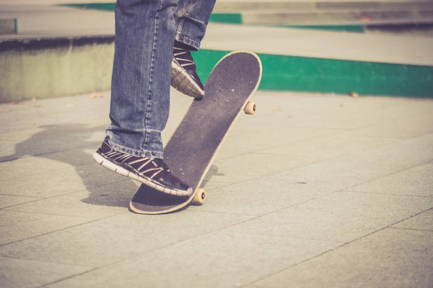 man in  sneakers with a skateboard  - Фото, зображення