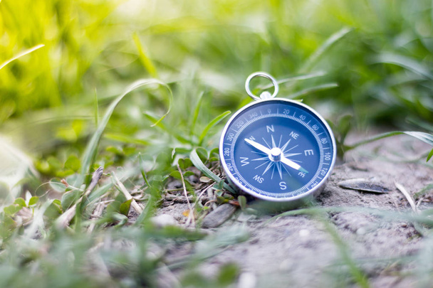 Adventure: Compass is lying on the floor, showing the direction  - Foto, immagini