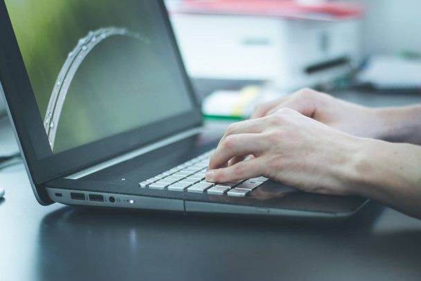 close-up of male hands typing on laptop  - Zdjęcie, obraz
