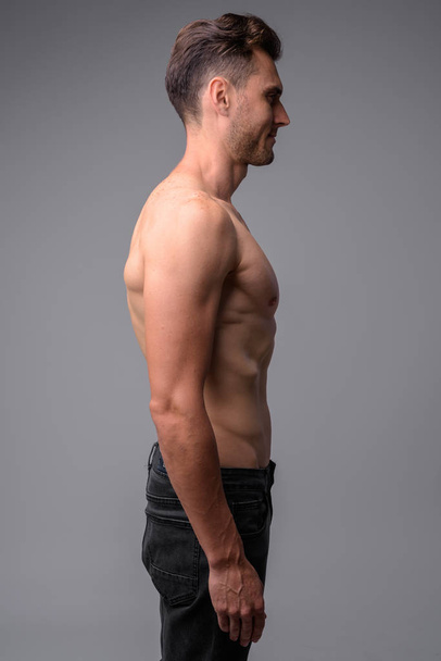 Studio shot of handsome muscular man shirtless - Photo, Image