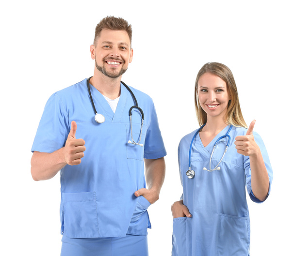 Mies ja nainen sairaanhoitajat osoittavat peukalo-up valkoisella taustalla
 - Valokuva, kuva