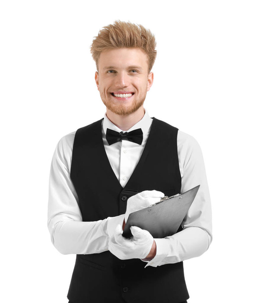 Όμορφος σερβιτόρος με πρόχειρο σε λευκό φόντο - Φωτογραφία, εικόνα