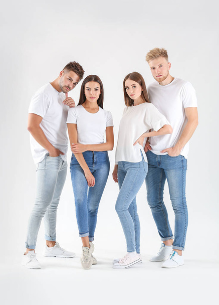 Group of young people in stylish casual clothes on white background - Photo, Image