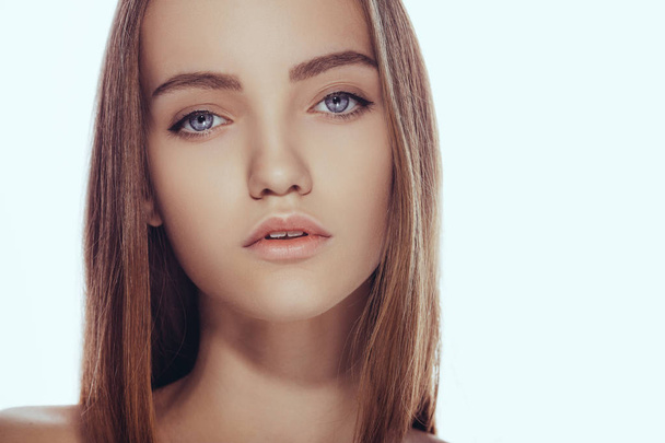 Beautiful face of young teen woman with clean fresh skin. - Valokuva, kuva