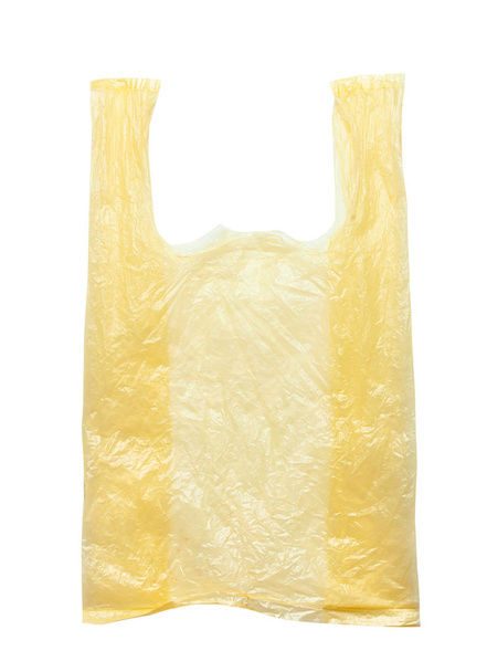 Sacs en plastique jaunes isolés sur fond blanc. Pollution de l'environnement par les sacs jetables, recyclage - Photo, image