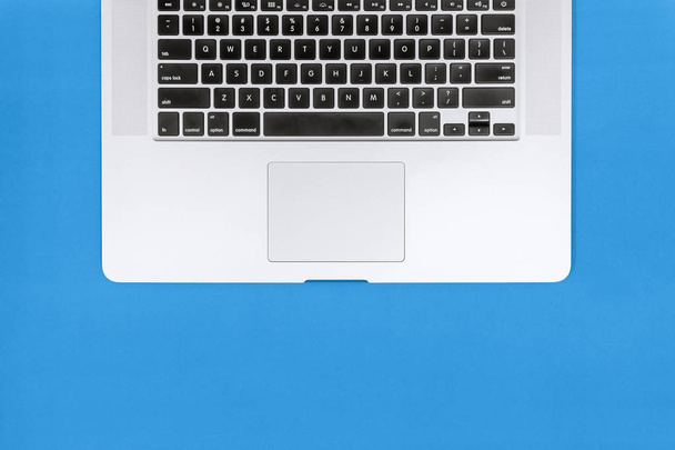 Close Up of Laptop Keyboard on Blue Background - Photo, Image