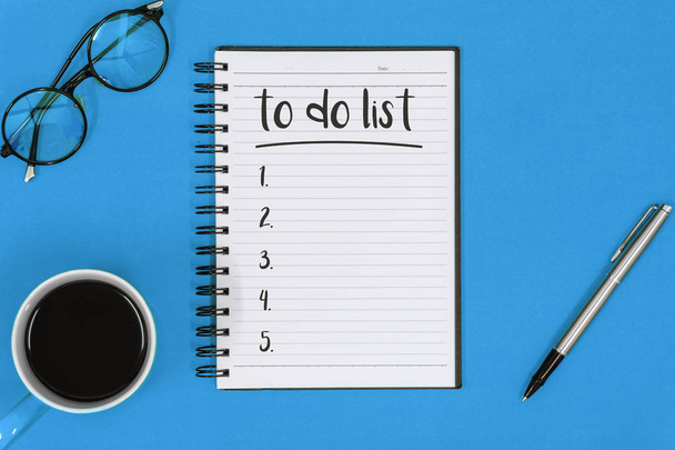 To Do List on Notepad Over Blue Background - Photo, Image