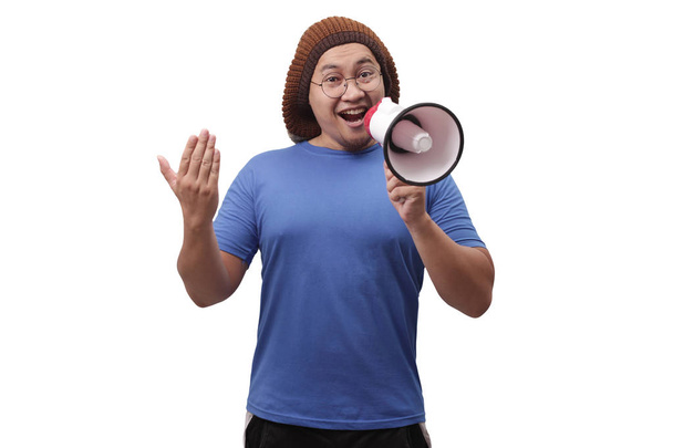 Mladý muž s megafonem reklamní koncepcí, usmívající se Expressi - Fotografie, Obrázek
