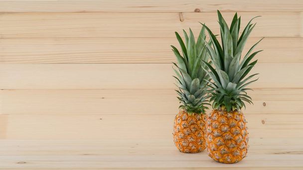 natural fresh tropical fruit of pineapple  on wooden background - Фото, зображення
