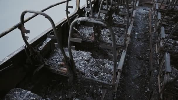 Bus after the fire. Explosion of a bomb in a passenger vehicle. The terrorist act in a bus carrying children. Accident, explosion, set fire. Burnt chairs, broken windows. Human sacrifice. Car accident - Кадры, видео