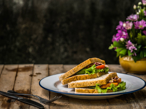 A dish of sandwiches on the wooden table. Selective focused - Fotó, kép