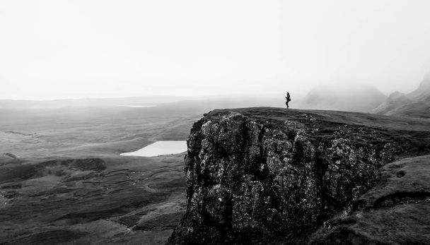 woman standing on the top of a cliff - Photo, Image