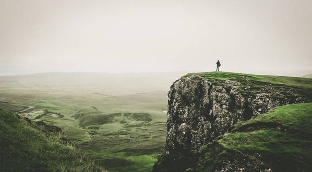 woman standing on the top of a cliff - Foto, Imagen