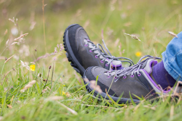 hiking boots in the grass on background - Zdjęcie, obraz