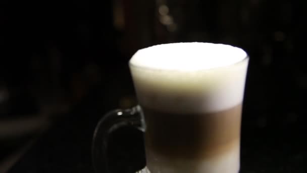 Glass of mochaccino or latte.Blurred background.Copy space - Filmati, video