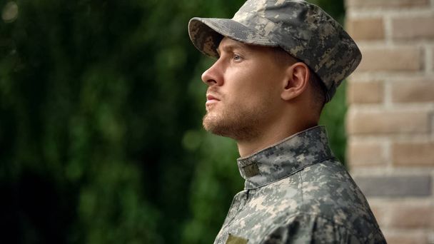 Army soldier facing reality of duty, struggling with mental issues, depression - Photo, image