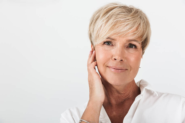 Portrait closeup of beautiful adult woman with short blond hair  - Photo, Image