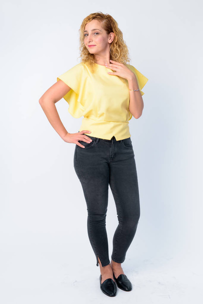 Full body shot of beautiful woman with curly blond hair - Photo, Image