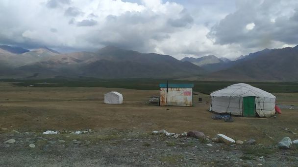 Osh, Kyrgyzstan, circa august 2019: Yurts at the road in Kyrgyzstan - Photo, image