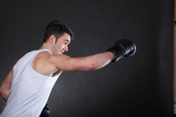 Portrait sportsman boxer in studio dark background - Foto, Imagen