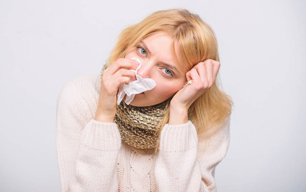 How to bring fever down. Girl sick hold thermometer and tissue. Measure temperature. Break fever remedies. Seasonal flu concept. Woman feels badly. Fever symptoms and causes. Sick girl with fever - Foto, Bild