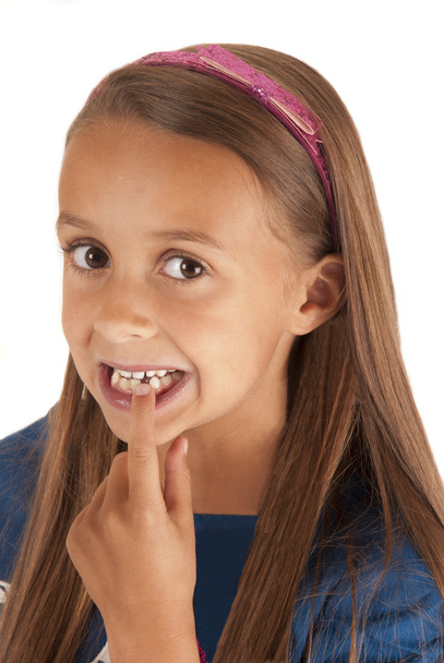 young girl pointing at missing tooth with pink headband - Фото, изображение