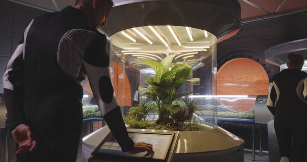 Вчений контролює інкубатор рослин
 - Фото, зображення