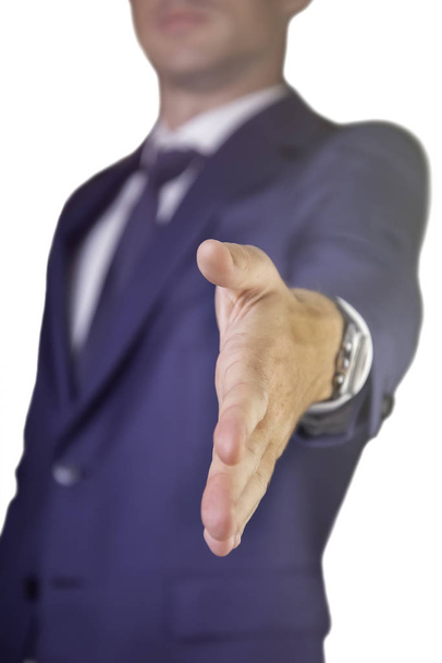 Business man rekken hand tot handshake. Man open hand klaar om een deal te verzegelen, geïsoleerd op een witte achtergrond  - Foto, afbeelding