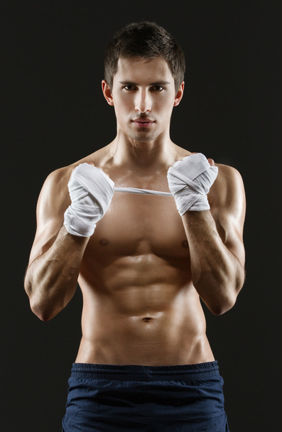 Half-length portrait of hand wrapping sportsman - Foto, afbeelding