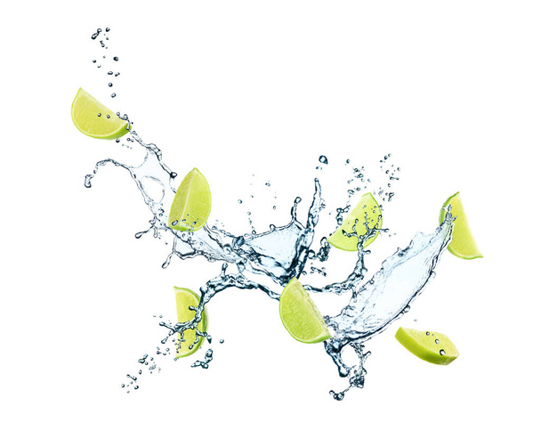Juicy lime and splashing water on white background - Φωτογραφία, εικόνα