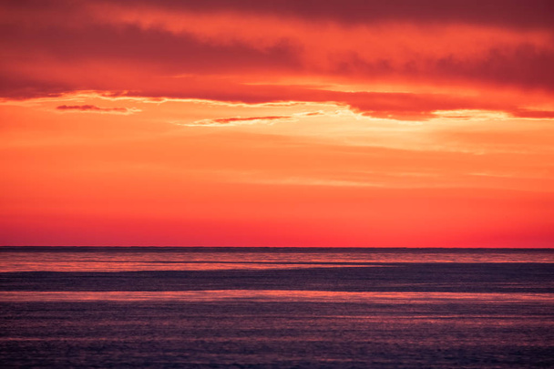 Beautiful red and orange sunset over the sea. - Foto, Imagem