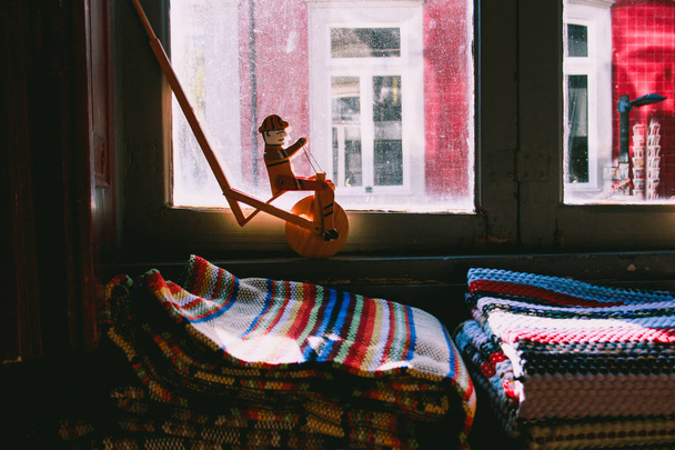 Close up of wooden roller toy and colorful cozy blankets - Photo, Image