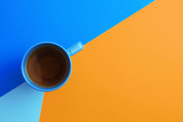 Cup of tea on color background, top view. Space for text - Photo, Image