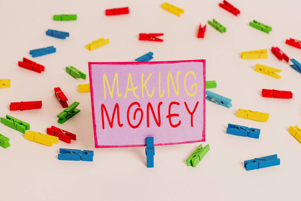 Conceptual hand writing showing Making Money. Business photo text Giving the opportunity to make a profit Earn financial support Colored clothespin papers empty reminder white floor office. - Fotografie, Obrázek