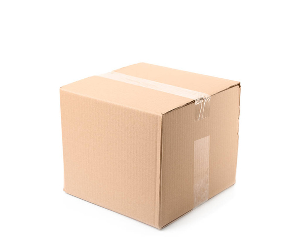Closed cardboard box on white background. Mockup for design - Foto, afbeelding