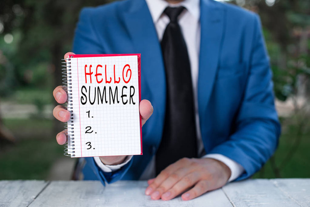 Text sign showing Hello Summer. Conceptual photo Welcoming the warmest season of the year comes after spring Man holds empty paper with copy space in front of him. - Photo, Image