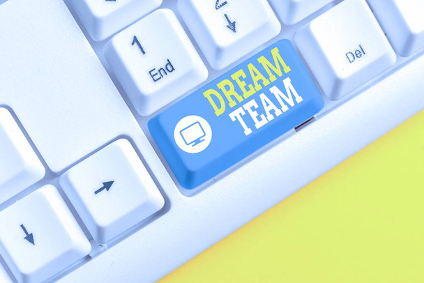 Text sign showing Dream Team. Conceptual photo Prefered unit or group that make the best out of a demonstrating White pc keyboard with empty note paper above white background key copy space. - Photo, Image