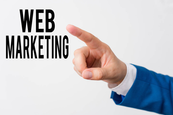 Writing note showing Web Marketing. Business photo showcasing Electronic commerce Advertising through internet Online seller Isolated hand pointing with finger. Business concept pointing finger. - Foto, Bild