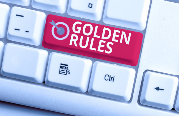 Handwriting text writing Golden Rules. Concept meaning Basic principle that should be followed Important Principle White pc keyboard with empty note paper above white background key copy space. - Photo, Image