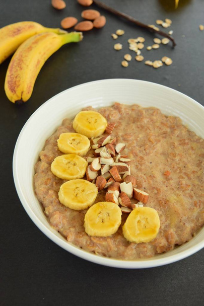 Banana almond vanilla oat porridge - Photo, Image