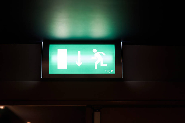 luminous emergency exit sign in the hotel corridor - Photo, Image