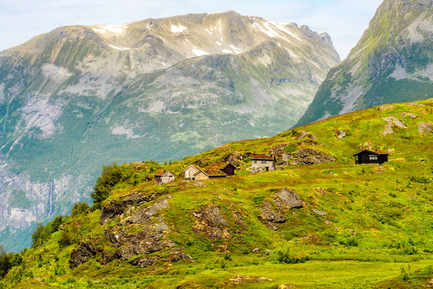 Norway mountain village. Norwegian wooden housee, green summer forest and mountains. - Photo, image