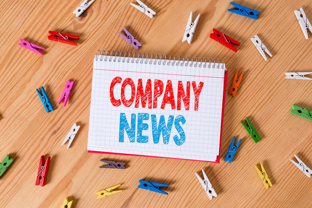 Conceptual hand writing showing Company News. Business photo text Latest Information and happening on a business Corporate Report Colored crumpled papers wooden floor background clothespin. - Photo, Image