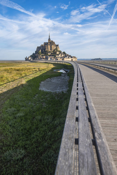 Only access road to Mont Saint Michael. Access is restricted, it can only be accessed by bus, horse carriage and vehicles with special permission for supply and cleaning. Access is also allowed on foot or by bicycle. - Photo, Image