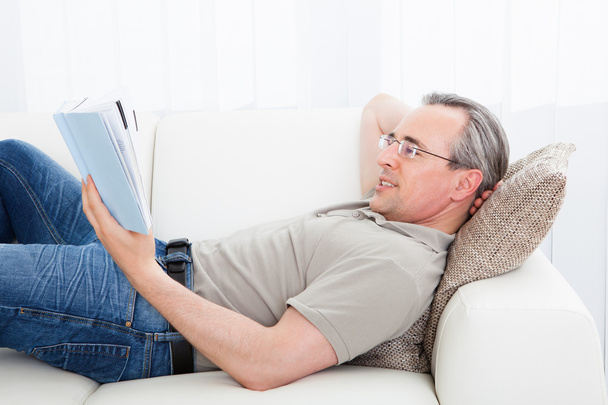 Mature man reading a book - Foto, imagen