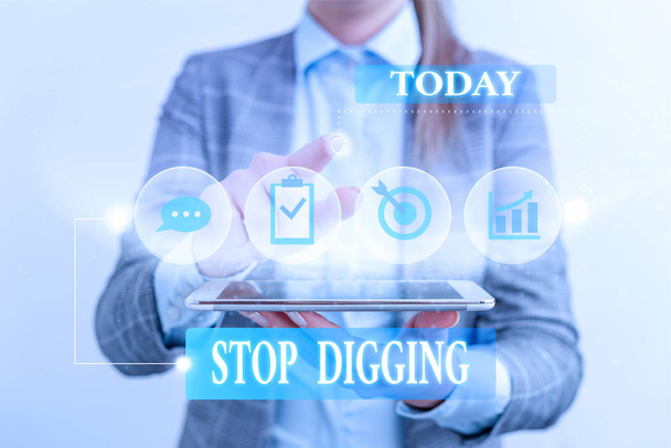 Word writing text Stop Digging. Business concept for Prevent Illegal excavation quarry Environment Conservation Female human wear formal work suit presenting presentation use smart device. - Foto, afbeelding