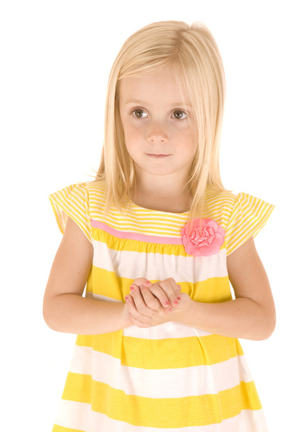 beautiful Young blonde girl with hands folded in yellow shirt - Фото, изображение